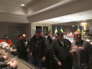 The boys gather in the Tomcat lounge for some beer, pizza and Leaf hockey.