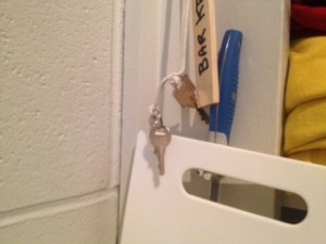 There is a hide a key on stage ....but in case someone hides it so well ....there is a second key hanging on the bar key.